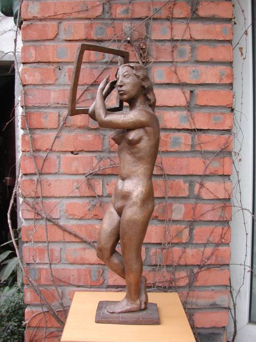 Nude sculpture entitled Woman with a Frame by Chinese sculptor Shen Xiaonan